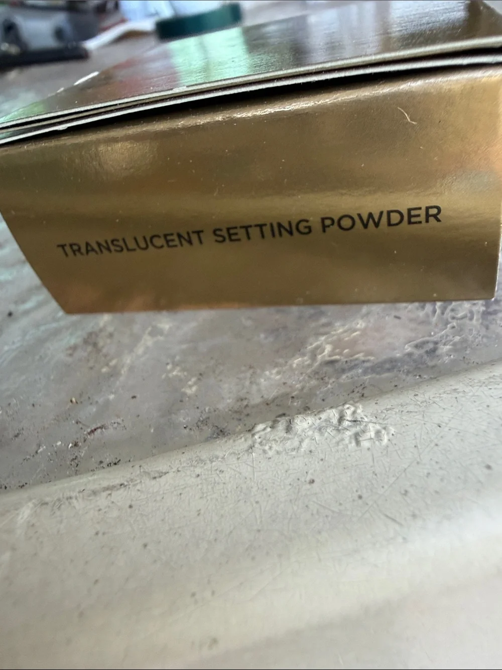 Hourglass Veil Translucent Setting Powder in Metallic Gold Packaging
